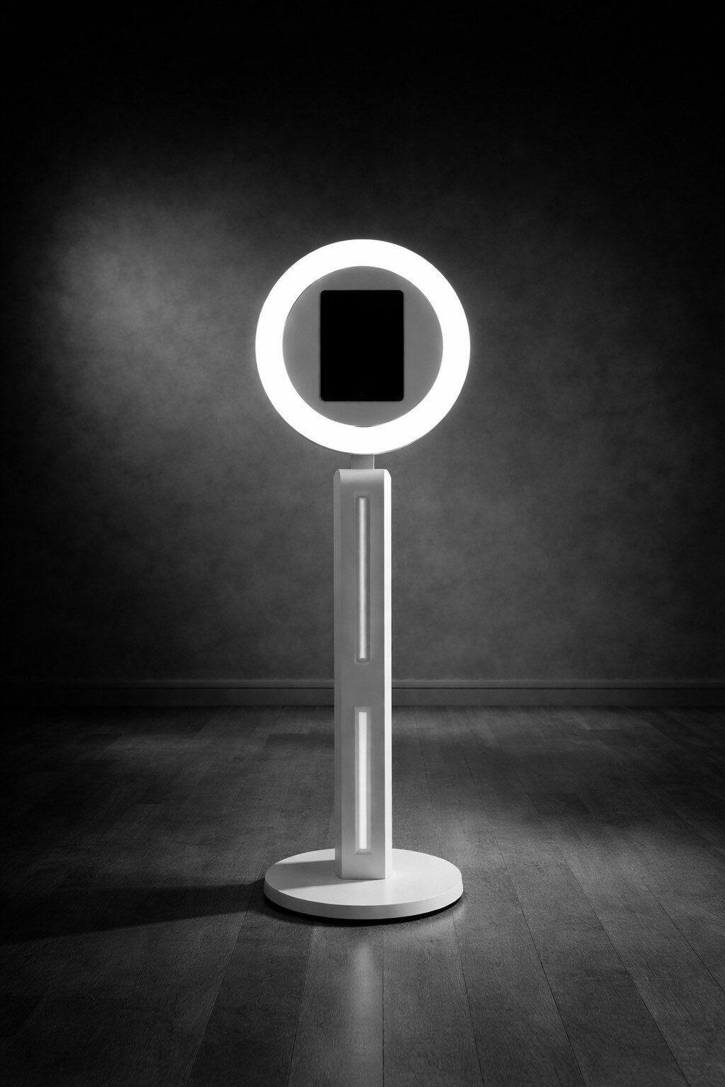 VibeCam photo booth illuminated against a black backdrop